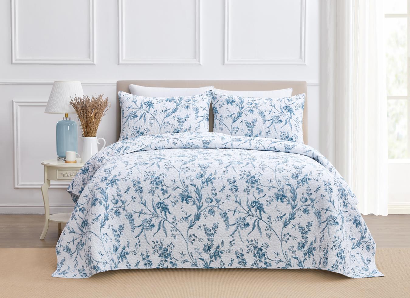 Blue and white quilt set photographed by AP Vision in a styled bedroom