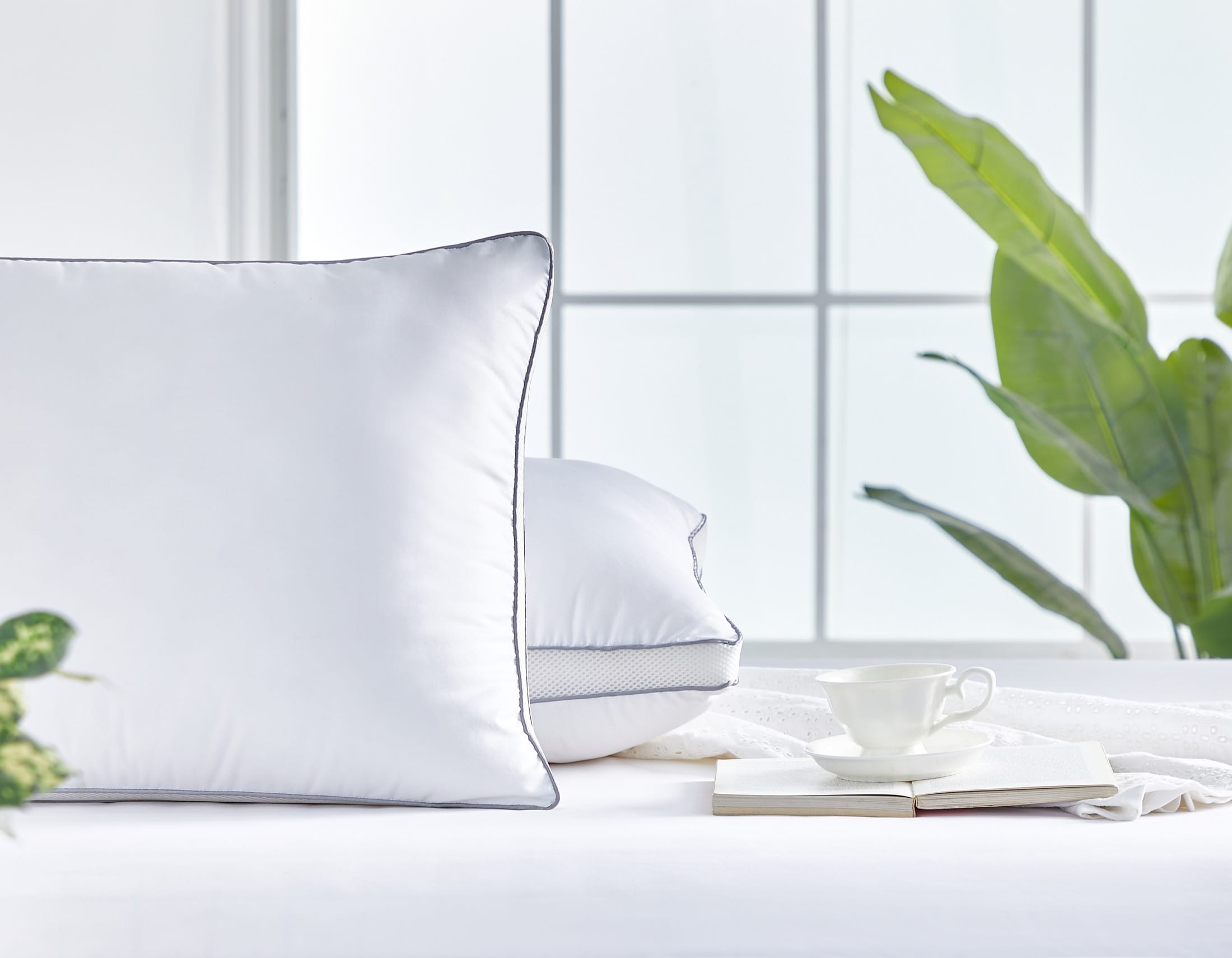 Sleeping pillows photographed close-up to show piping and gusset construction