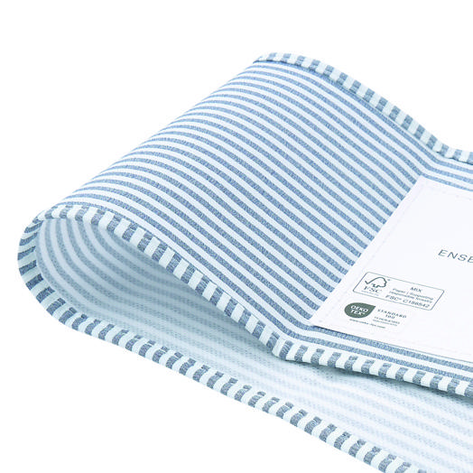 Close textile detail showing construction, finish, and product labeling