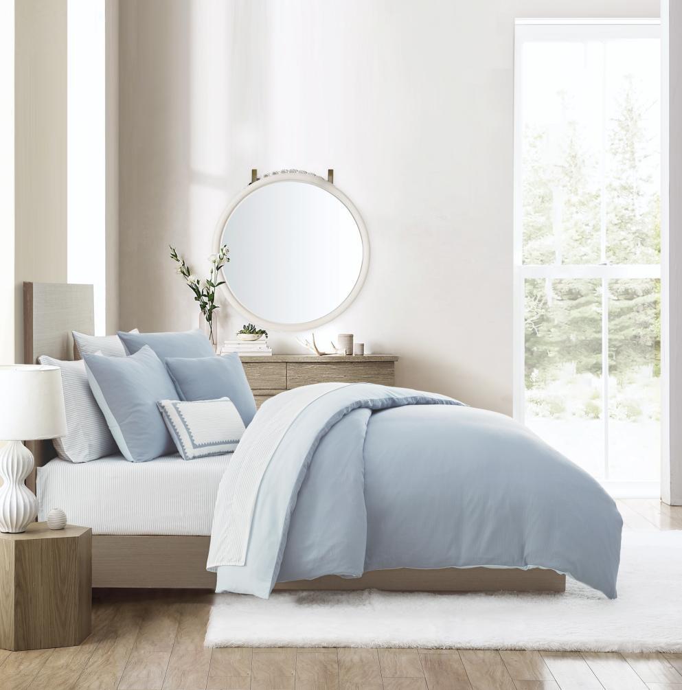 Blue bedding collection photographed in a complete bedroom room set